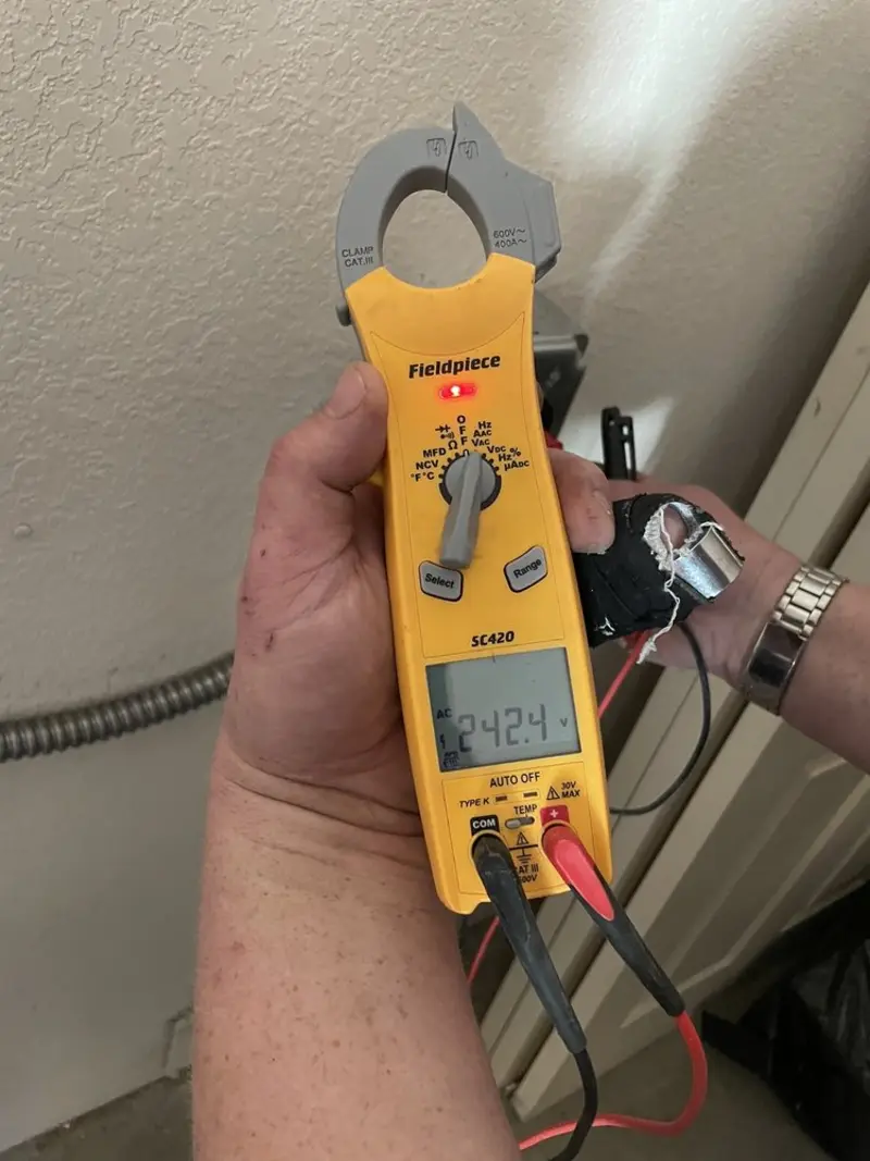Voltage testing with clamp meter during Recessed Lighting Installation in Sherrelwood